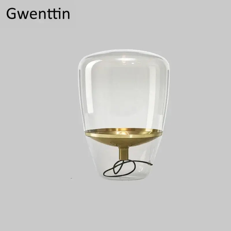 Clear glass led table lamp with gold-toned metal base and stem for bedroom lighting use