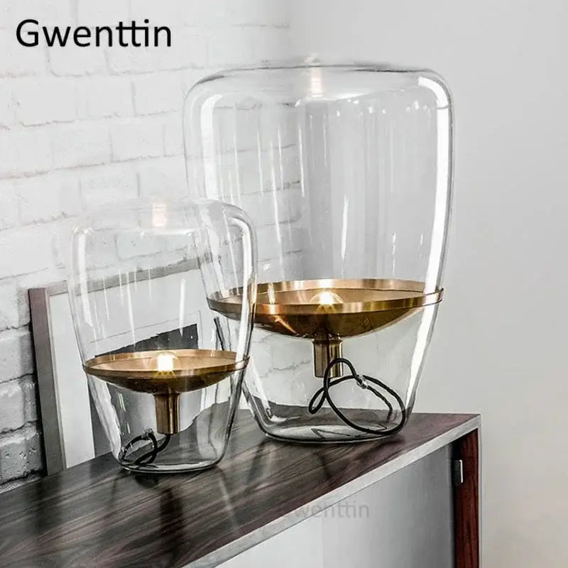 Amber glass and brass led table lamp with clear glass shade and minimalist design for modern bedroom lighting