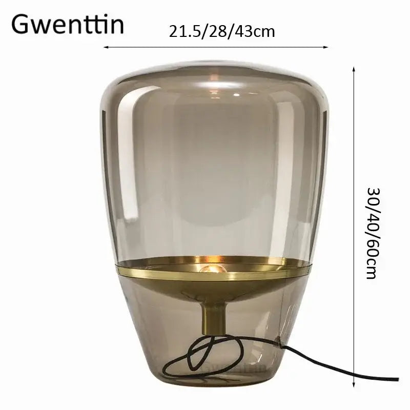 Gwenttin led table lamp with amber smoke glass shade and polished brass base for elegant bedroom lighting