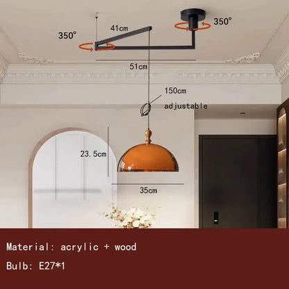 Adjustable modern pendant light with amber glass dome and dark wood accent for dining room lighting