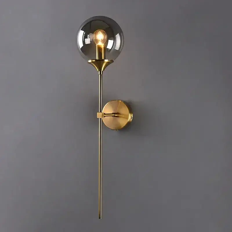 A sleek brass finish amber glass ball sconce light with smoked globe and exposed filament bulb for bedroom decorbites glass ball