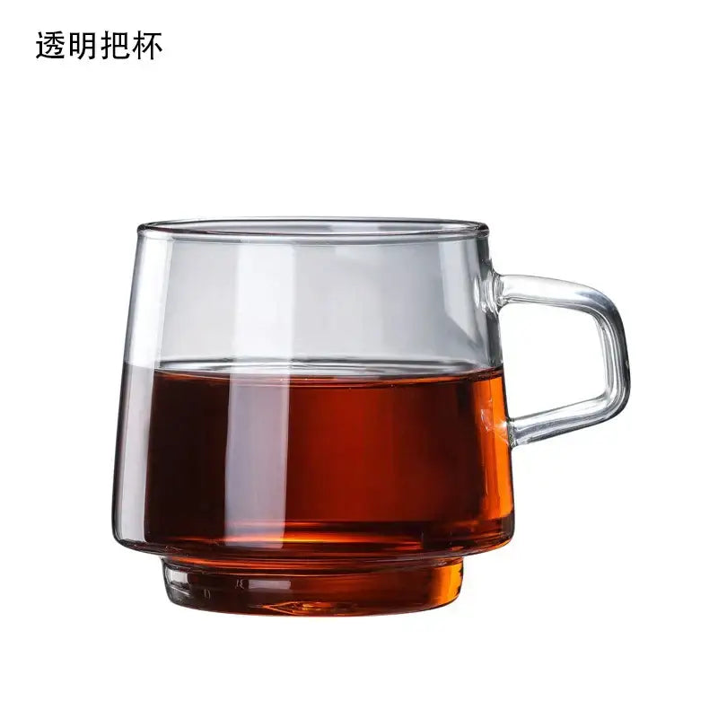 Clear glass coffee mug with sturdy handle filled with amber liquid ideal for juice tea from decorbites glass coffee collection