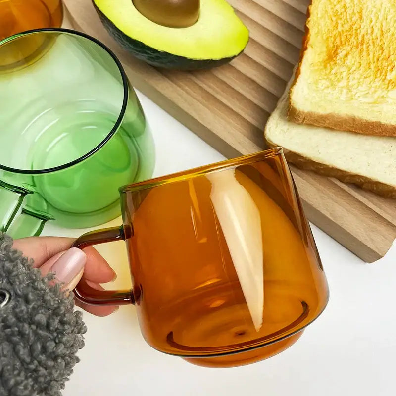 Amber glass coffee mug with sleek modern design and black rim by decorbites glass coffee for tea and juice use