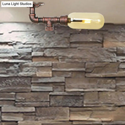 وحدة إضاءة بيضاوية شبه مستوية من ديكوربايتس™ مصنوعة من زجاج العنبر والنحاس المتآكل بتصميم أنابيب صناعية لغرفة المعيشة