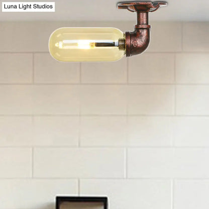 وحدة إضاءة بيضاوية شبه مستوية من ديكوربايتس™ مصنوعة من زجاج العنبر والنحاس المتآكل بتصميم أنابيب صناعية لغرفة المعيشة