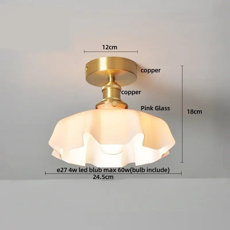 A vintage-style ceiling light with a copper led ceiling base and pink glass shade ideal for dining rooms
