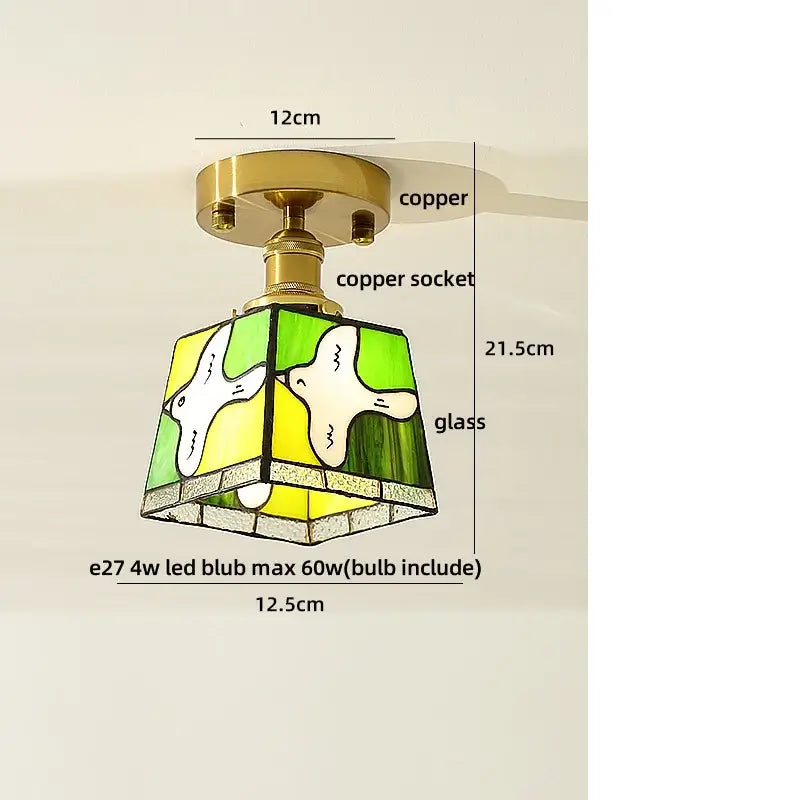 A charming green and yellow stained glass ceiling light with white bird motifs and a copper led ceiling socket and base
