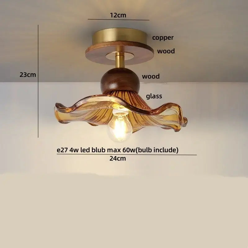 A warm amber glass wood copper led ceiling light with wavy leaf design and wooden accents for dining room