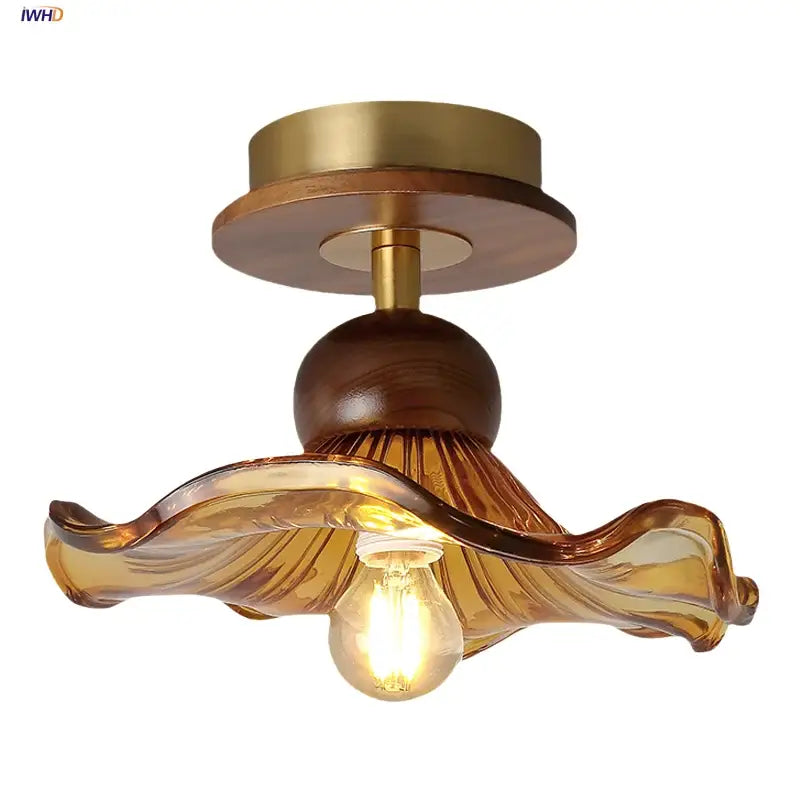 Amber glass wood copper led ceiling light with warm amber glass pendant, wooden base, and brass accents wavy design
