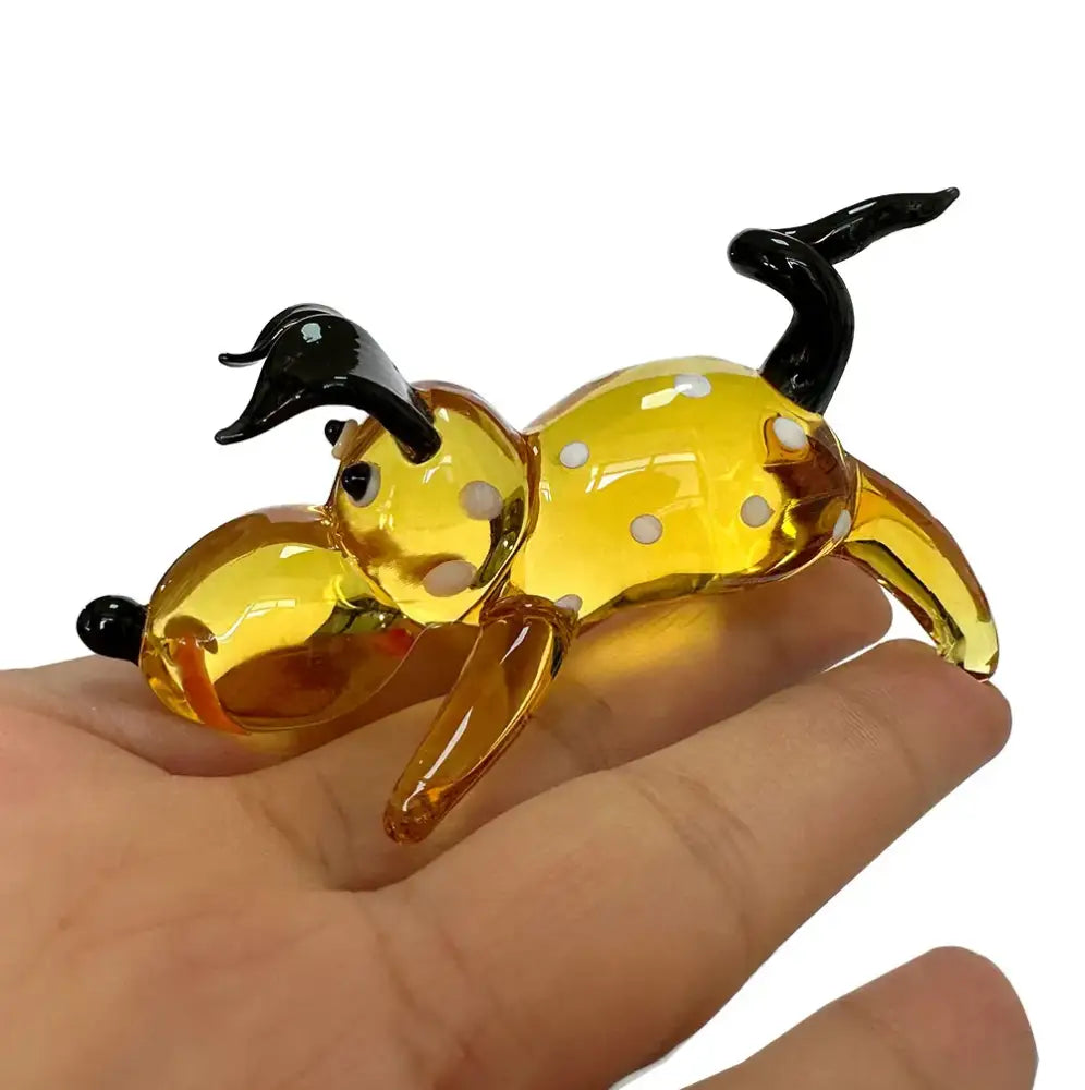 Amber and gold crystal cartoon puppy figurine in translucent yellow glass with black ears and tail for bedroom decor