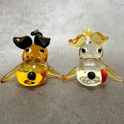 Two hand-blown glass crystal cartoon puppy figurines in amber and clear with gold accents for puppy figurine table decor