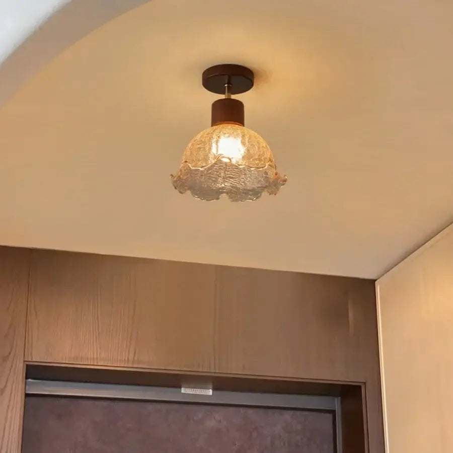 A warm-toned amber ice crack glass ceiling light with dark wood finish for bedroom decorbites amber ice fixture