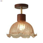 A warm-toned amber ice crack glass ceiling light with ruffled edges and dark wood accents for bedroom decorbites amber ice