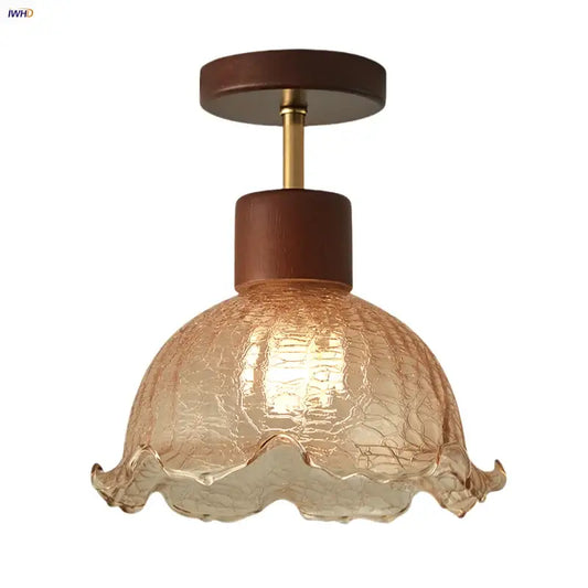 A warm-toned amber ice crack glass ceiling light with ruffled edges and dark wood accents for bedroom decorbites amber ice