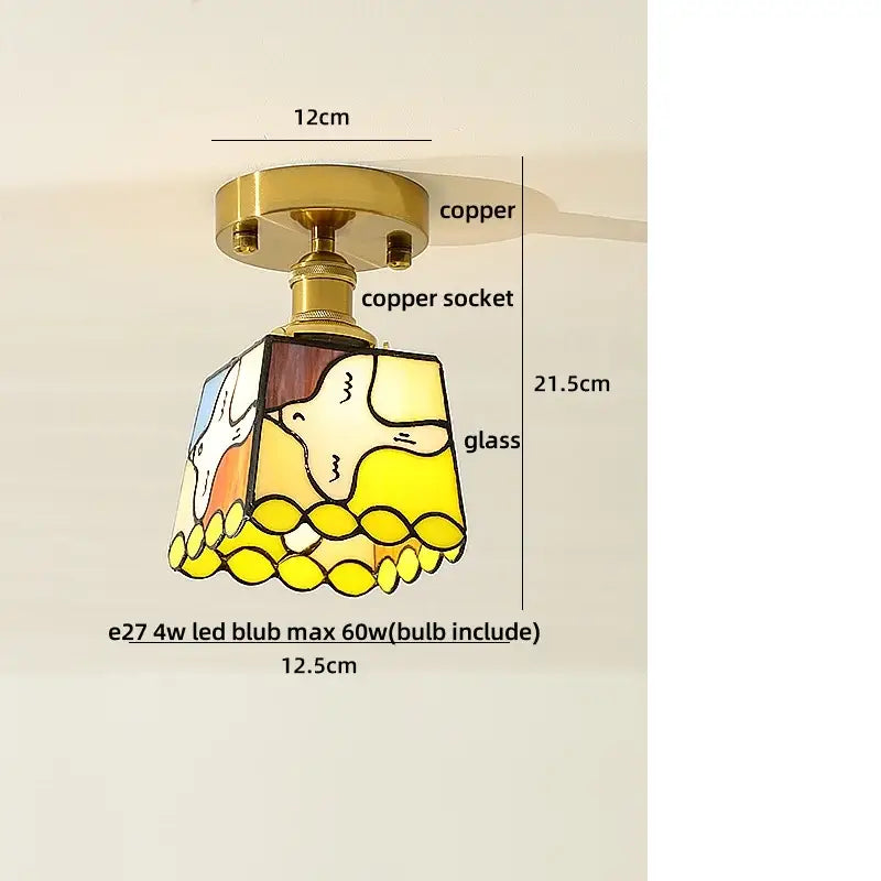 A charming yellow and white amber ice crack glass ceiling light with copper base and illustrated bird design by decorbites