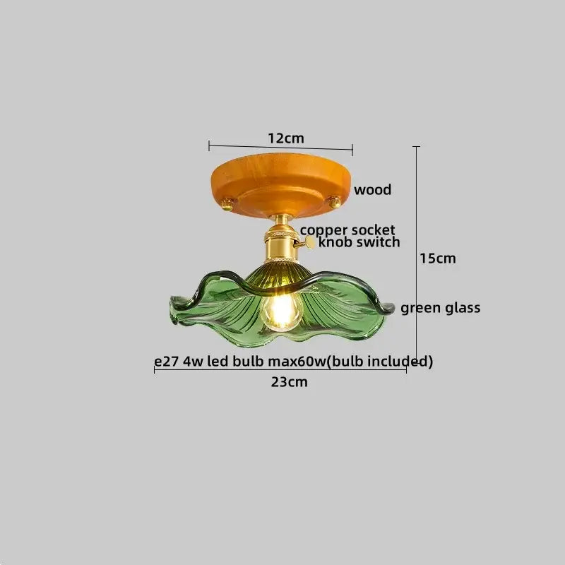Amber leaf brass glass ceiling lamp with green glass leaf pendant, wooden base, and copper socket by decorbites brass glass