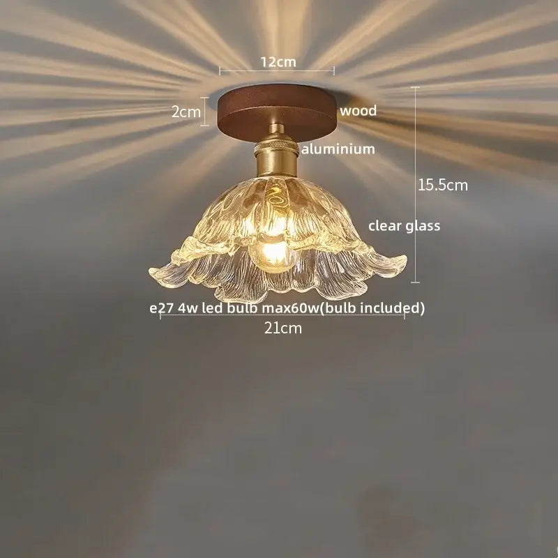 Amber leaf brass glass ceiling lamp with delicate clear flower-shaped glass, wooden base, and decorbites brass glass accents