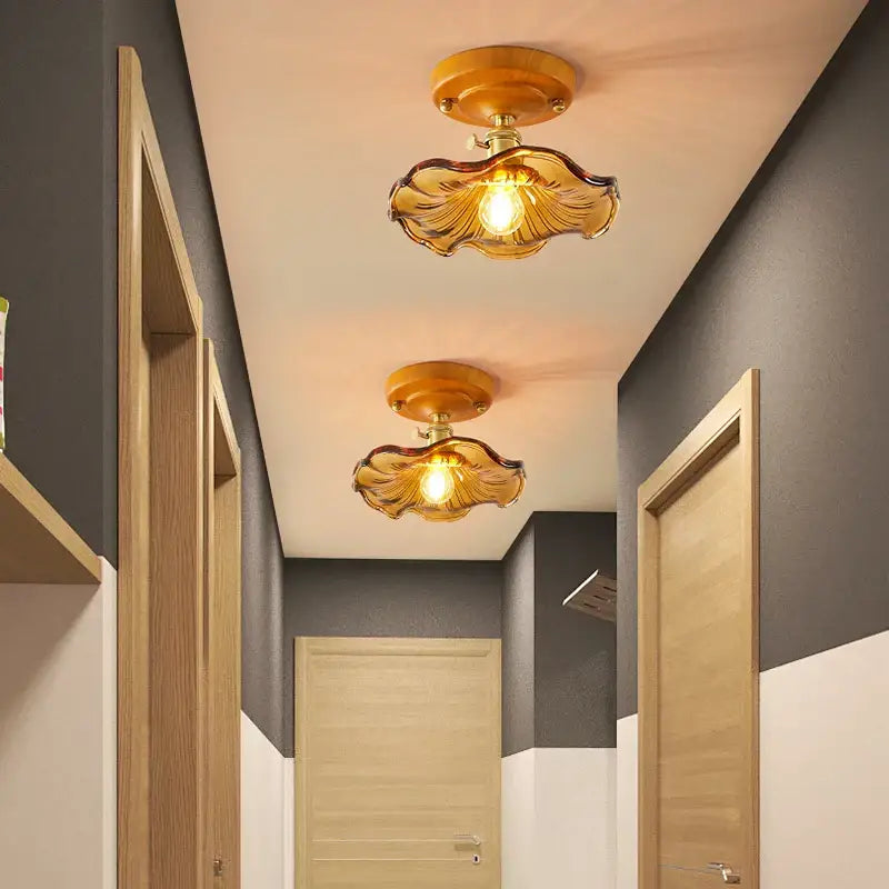 Two amber leaf brass glass ceiling lamps with scalloped design and decorbites brass glass fixtures for bedroom decor