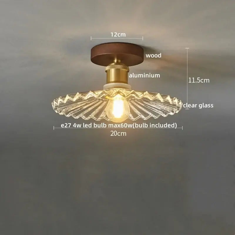 Amber leaf brass glass ceiling lamp with dark wood base, brass stem, and clear scalloped glass shade for bedroom decorbites brass glass