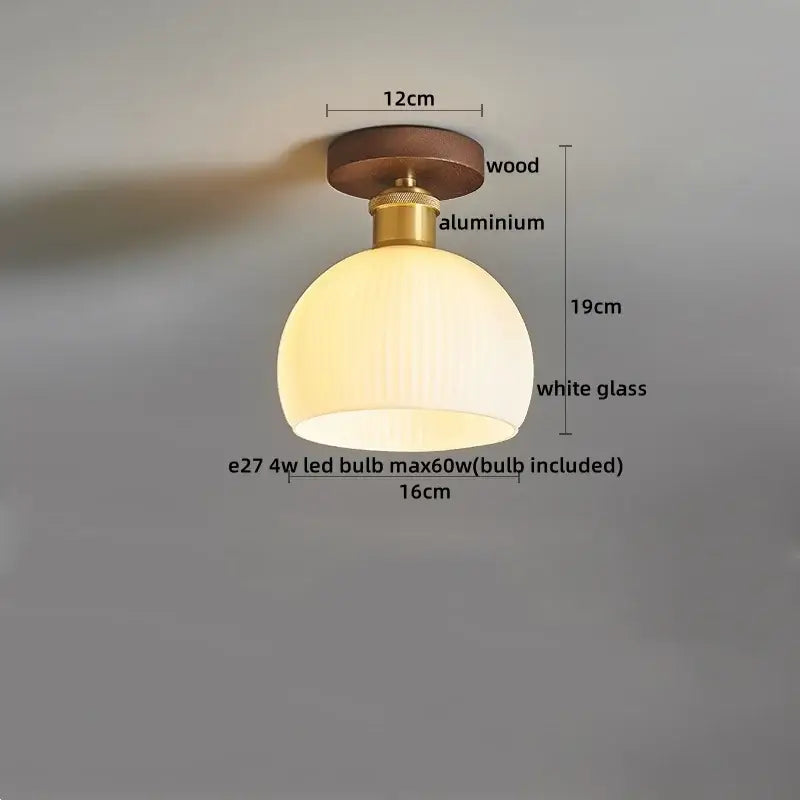 Amber leaf brass glass ceiling lamp with warm white glass dome, wooden base, and brass glass decorbites hardware