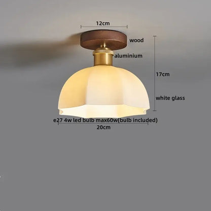 Amber leaf brass glass ceiling lamp with warm-toned dome light, wooden base, and brass glass ceiling stem decorbites brass glass