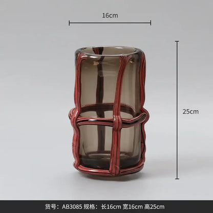 A sleek 25cm amber translucent glass vase with a glossy red woven wire frame for home decor and decorbites clear glass collections