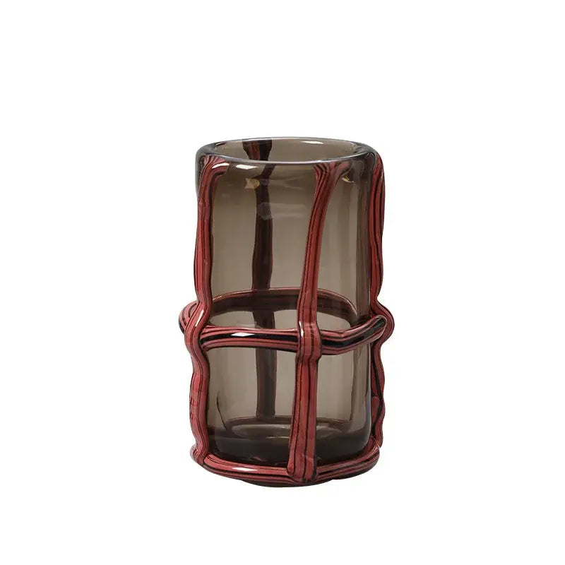A sleek translucent amber glass vase with a woven red-brown wire frame for home decor and decorbites clear glass display