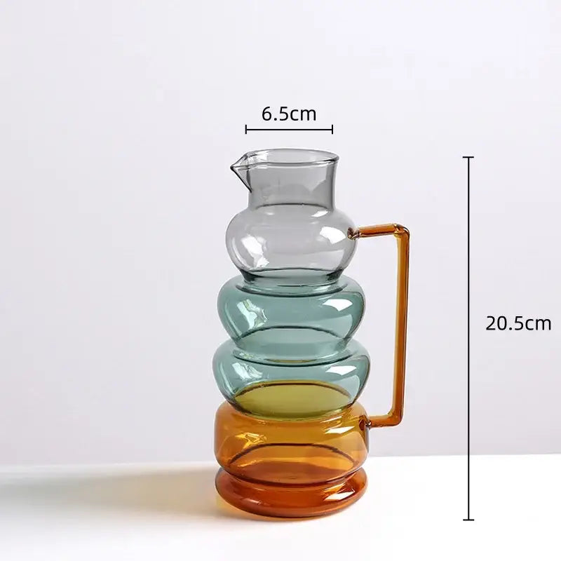 A modern amber and teal glass bubble ring vase with a tiered design and orange handle for living room decorbites decor