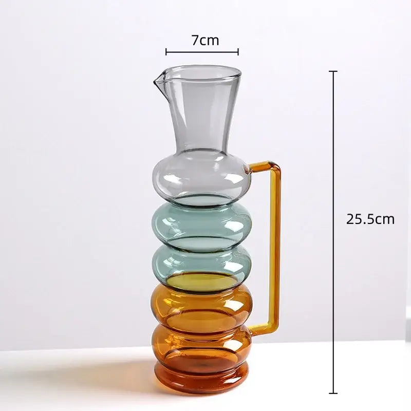 A modern amber and teal glass bubble ring vase with a multi-tiered stacked design and amber handle for decorbites glass bubble decor