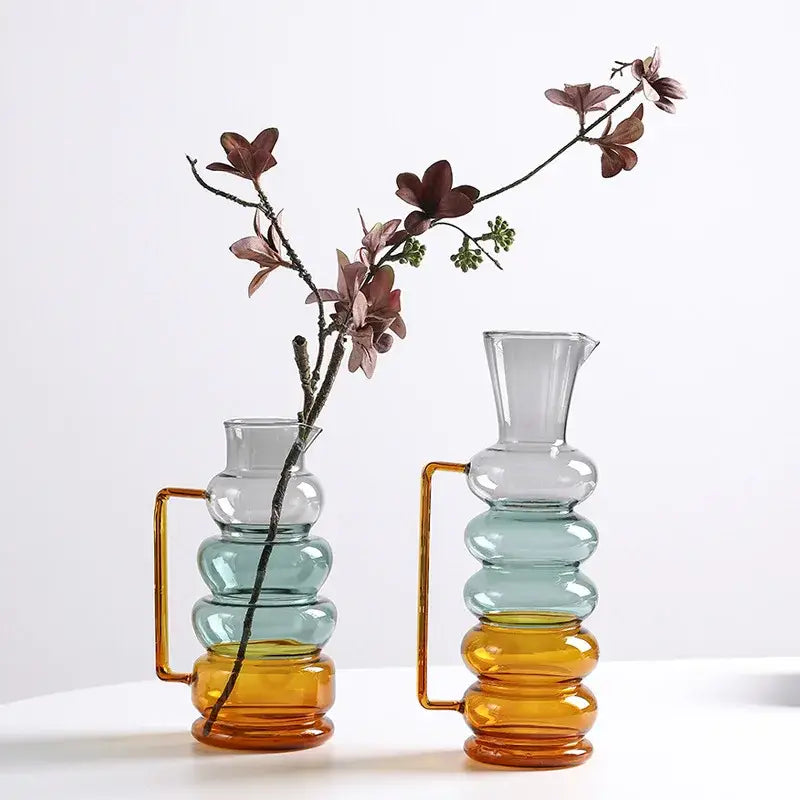 Two stacked amber and teal glass bubble ring vases with gold-toned handles for living room decor by decorbites glass bubble