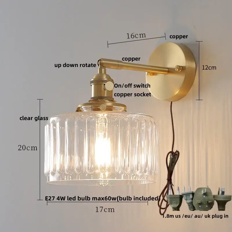 Copper-finished wall sconce with amber textured clear glass shade featuring decorbites clear glass design