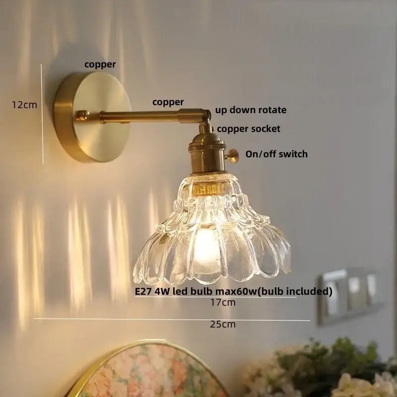 Copper-finished wall sconce with amber textured clear glass shade and adjustable arm for bedroom decorbites clear glass lighting
