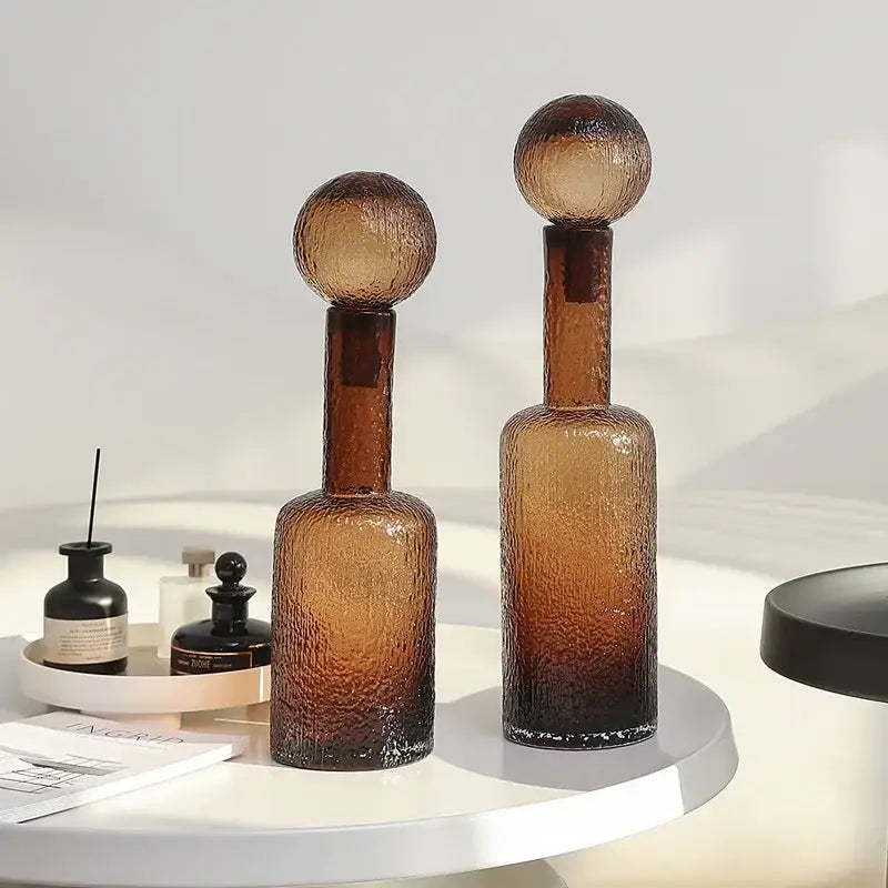 Two amber textured decorbites clear glass vase decanters with bubble-like surfaces and spherical tops for living room decor