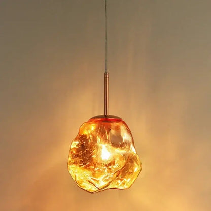 Amber textured ice glass pendant light with warm amber glass and copper-toned metal stem for dining room decorbites ice glass