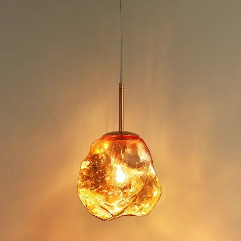 Amber textured ice glass pendant light with warm amber glass and copper-toned metal stem for dining room decorbites ice glass