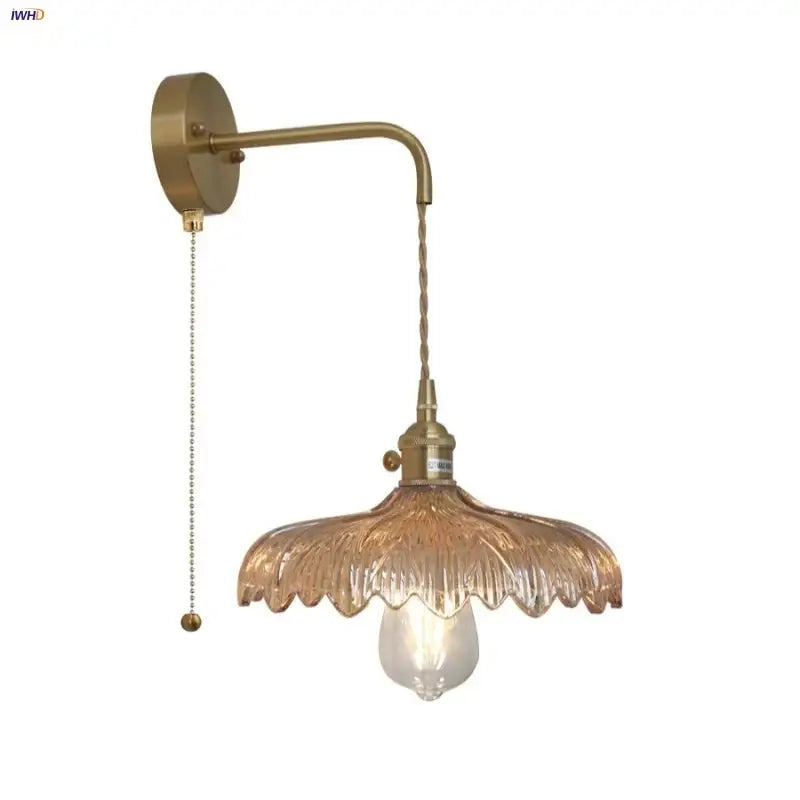 Brass-finished wall light with amber vintage led textured glass shade and twisted cord pull for bedroom decorbites amber vintage