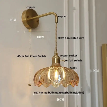 Antique brass-finished amber vintage led wall light with petal-shaped glass shade and adjustable copper wire arm by decorbites