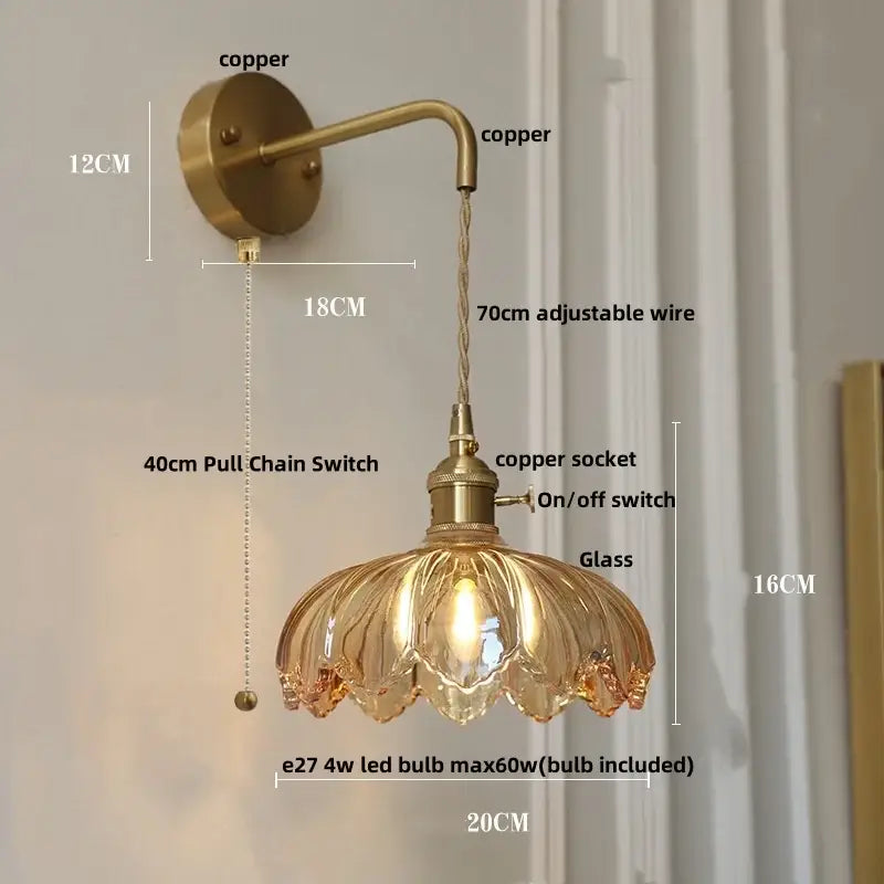 Antique brass-finished amber vintage led wall light with petal-shaped glass shade and adjustable copper wire arm by decorbites