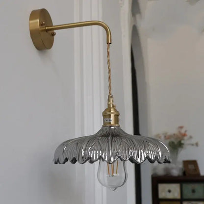 Amber vintage led wall light with a brass pull chain and clear petal-shaped glass shade for stylish wall light decorbites amber vintage