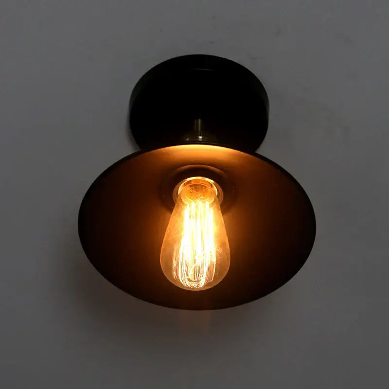 Black metal wall sconce with warm glowing edison bulb for decorbites american copper ceiling lamp lighting