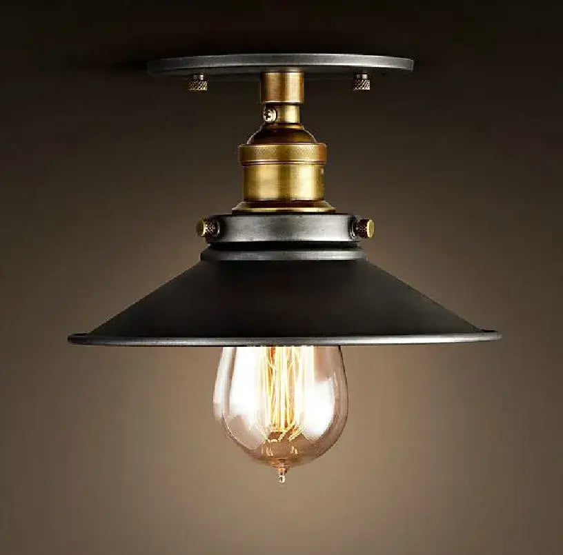 Industrial-style american copper ceiling lamp with black metal shade brass accents and exposed filament bulb from decorbites