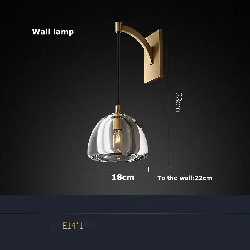 A decorbites american copper modern wall lamp with a gold-toned bracket and clear glass dome for elegant lighting