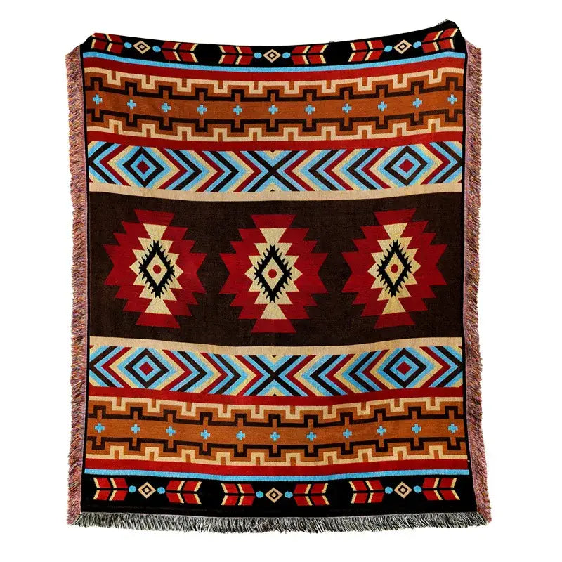 A woven american country plaid blanket sofa cover with bold red blue brown and black geometric patterns and fringed edges