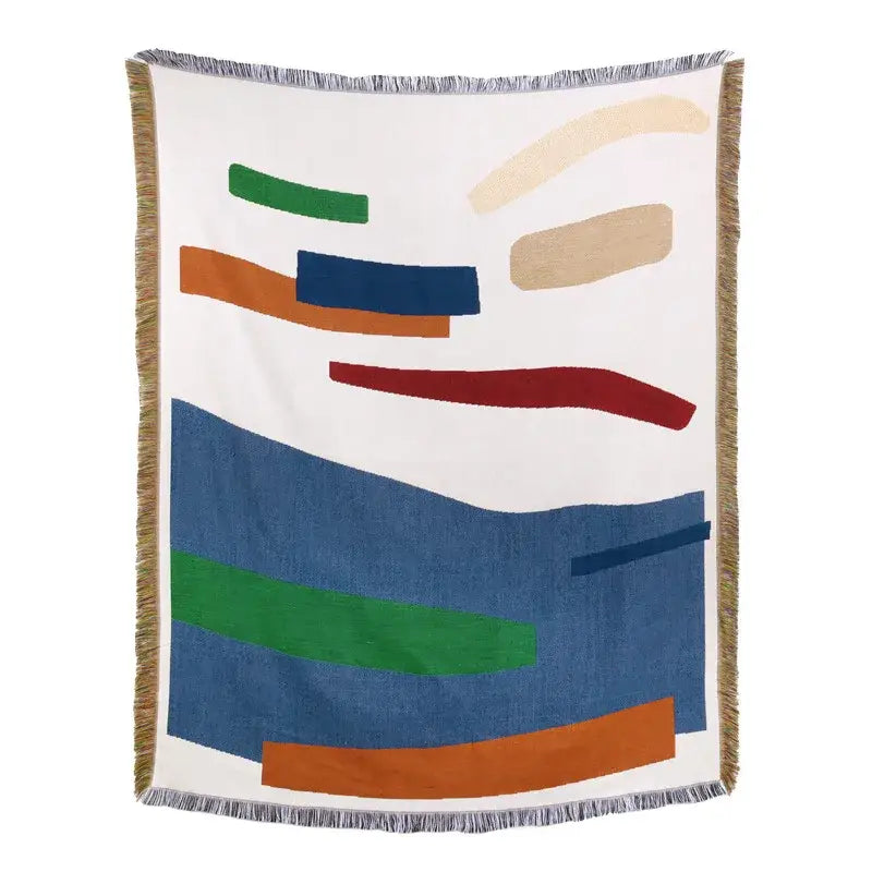 White throw blanket with green blue orange beige geometric shapes and fringed edges as american country plaid sofa cover