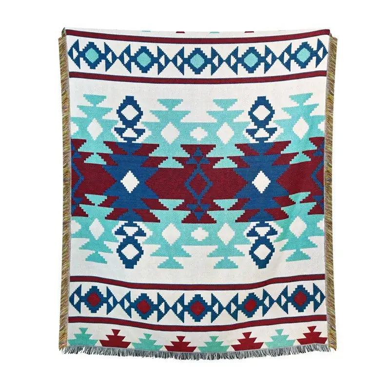 A woven american country plaid blanket sofa cover with geometric tribal pattern in teal maroon and navy blue with fringed edges