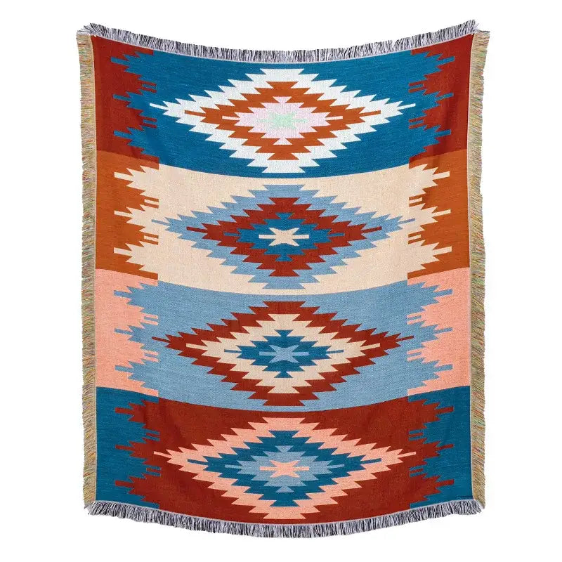 A woven american country plaid blanket sofa cover with blue terracotta and cream geometric diamonds and fringed edges