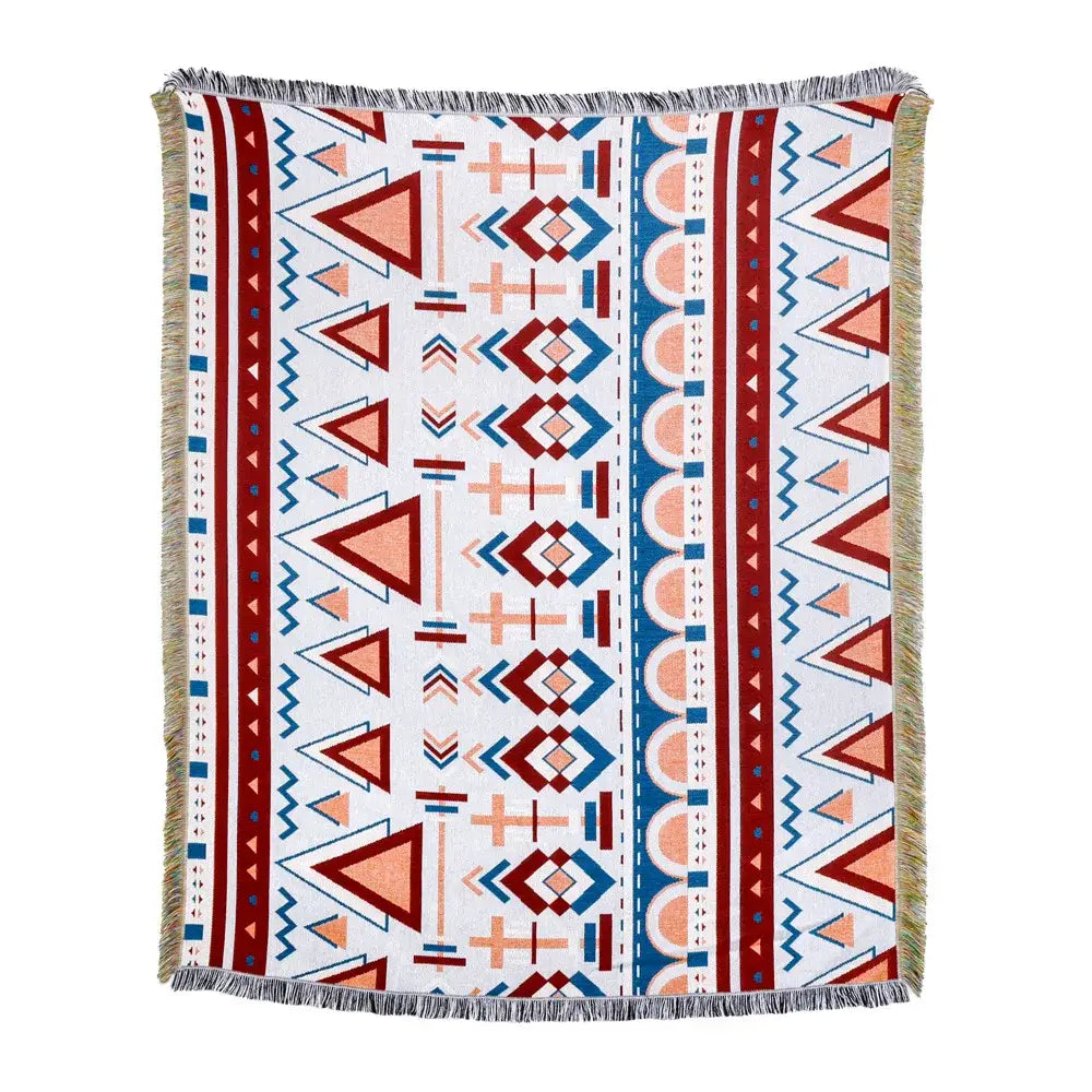 A rectangular american country plaid blanket sofa cover in white with bold red blue and peach geometric patterns and fringed edges