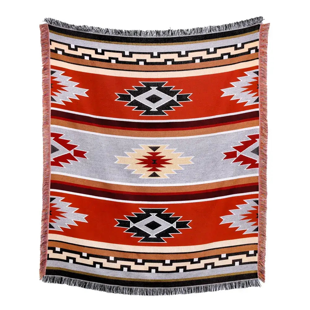 A woven american country plaid blanket sofa cover with bold red black gray and beige geometric patterns and fringed edges
