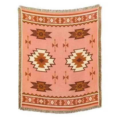 A soft peach-colored woven blanket sofa cover with geometric tribal pattern and fringed edges for american country plaid decor