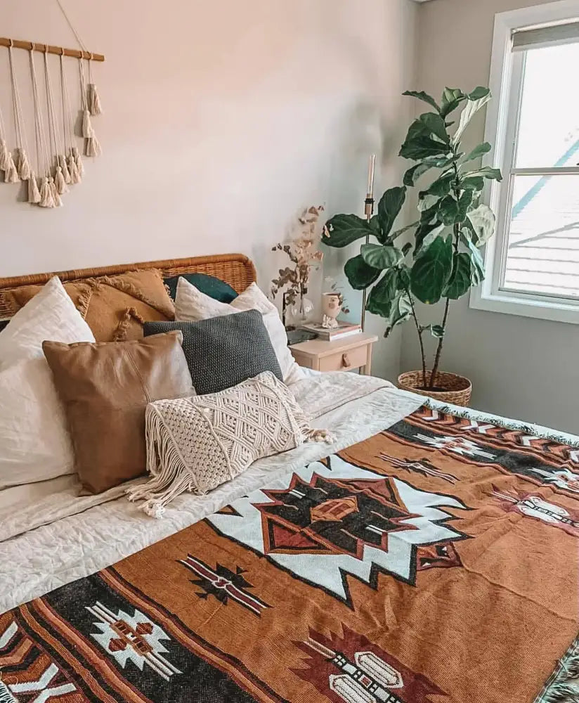 Warm-toned american country plaid blanket sofa cover with rust black and cream geometric patterns for living room